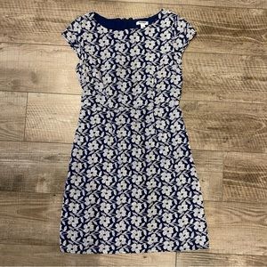4/$20 Cotton lined embroidered navy dress with white stitching.